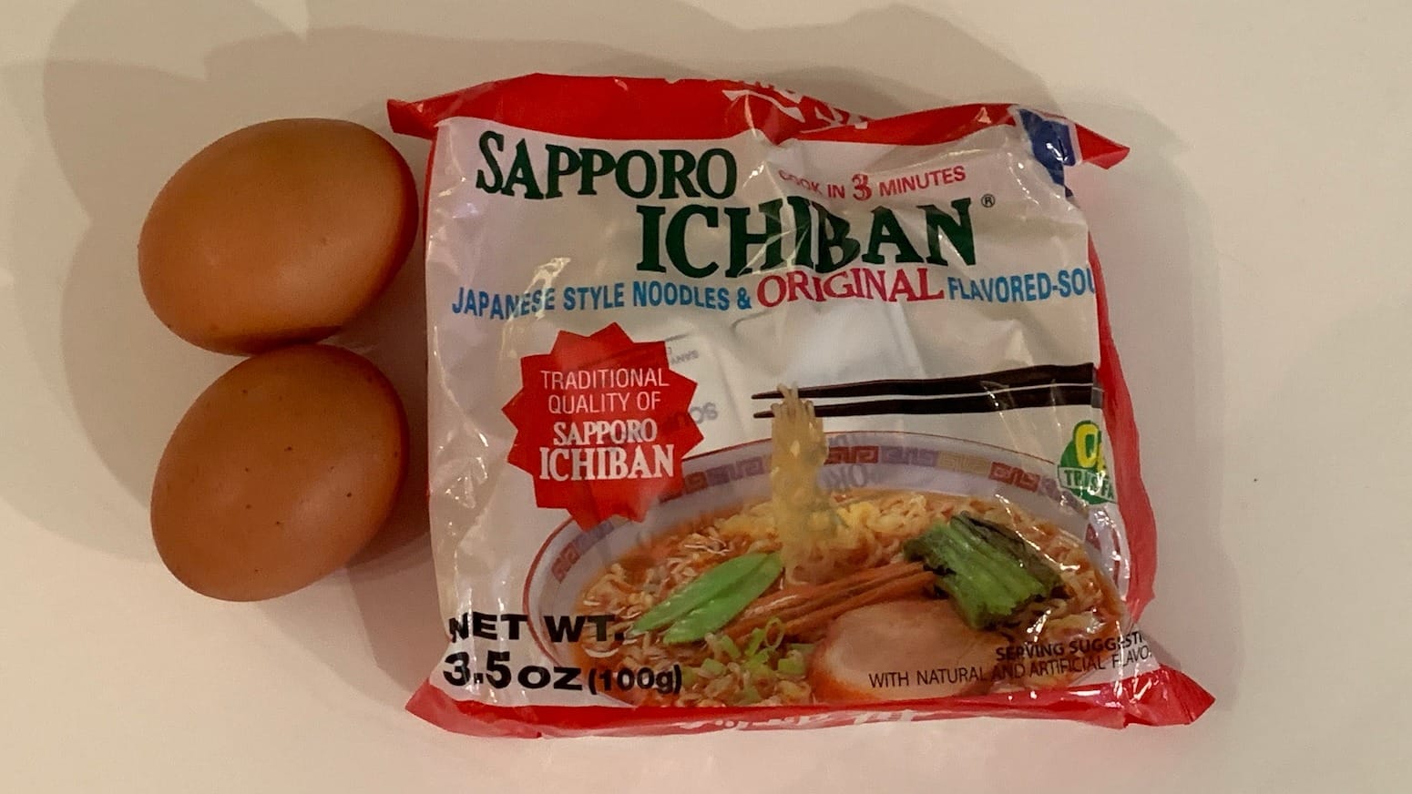Two eggs and a package of SAPPORO ICHIBAN JAPANESE STYLE NOODLES & ORIGINAL FLAVORED-SOUP