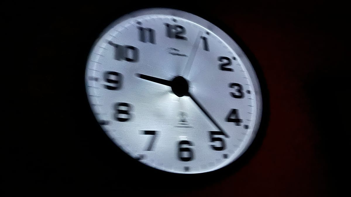 Blurry photo of the illuminated Atomic clock in the living room