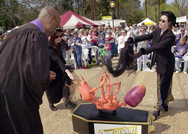 Actors conduct New Orleans style funeral for fake fire ANT at Fire Ant Festival Ashburn GA Photo: Erik S. Lesser/Getty Images