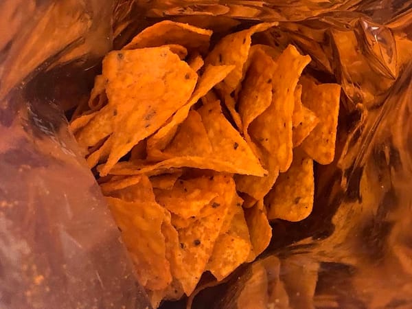 The violently-orange-colored Doritos inside a bag of Spicy Sweet Chili Doritos