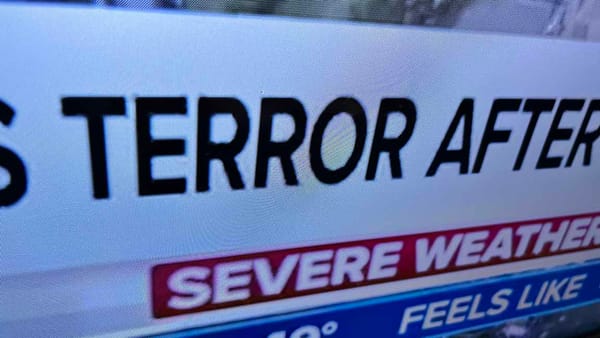 Extreme closeup of my TV screen tuned to a weather program and a Chyron including the word TERROR