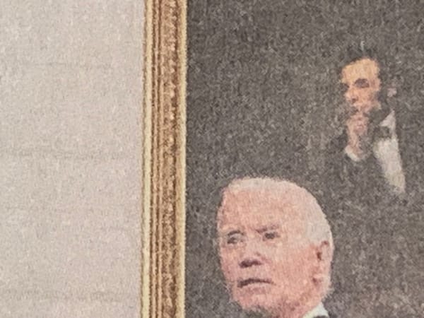 Detail of NYT photo of Joe Biden standing in front of portrait of Abraham Lincoln