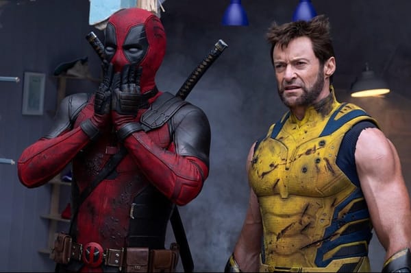 Deadpool holding hands up to mouth in dismay as Wolverine squints at whatever they are both looking at