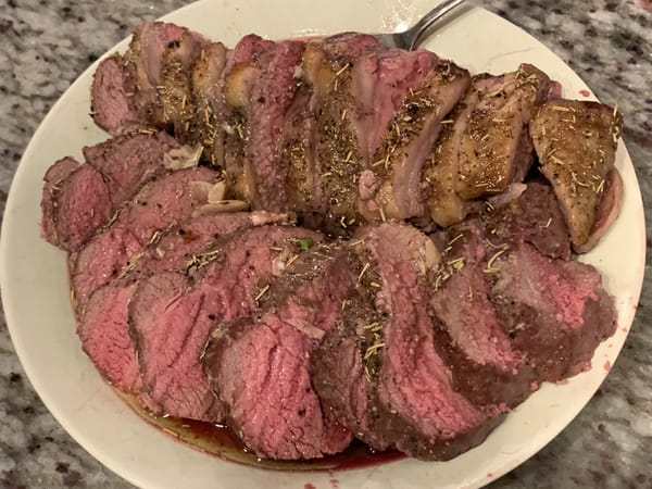 A platter of medium-rare lamb roast